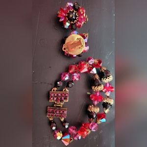 Schiaparelli unsigned bracelet and clip on earrings red pink black glass